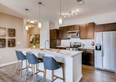 Acadia Espresso Dark Brown Cabinets Finished Kitchen and Island White Marbled Counter Tops