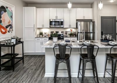 Acadia White Cabinets Finished Kitchen and Island Marbled Counter Tops