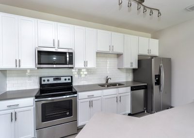 Acadia White Cabinets Finished Kitchen Light Gray Counter Tops